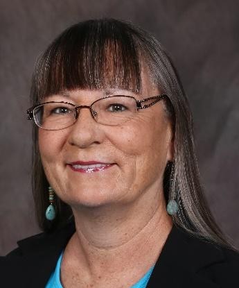 Headshot of Eva Nevarez St. John